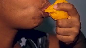 Sexy mouth ebony playing with a mango on tubepornebony.com