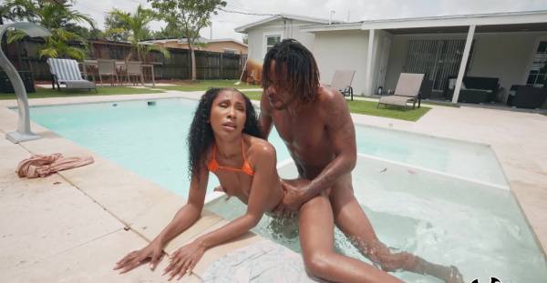 Aroused ebony goes very loud during outdoor pool porno with her new BF on tubepornebony.com